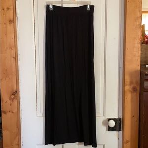 Apt 9 black long skirt with on left side slit .